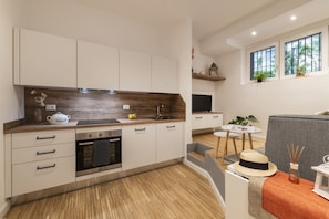 Fridge, microwave, stovetop, coffee/tea maker