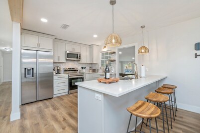 Updated 4-BR home. 7 mins from beach. Huge backyard w/ firepit