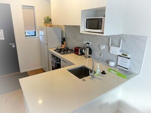 Microwave, toaster, cookware/dishes/utensils