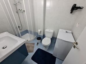 Shower, free toiletries, hair dryer, slippers
