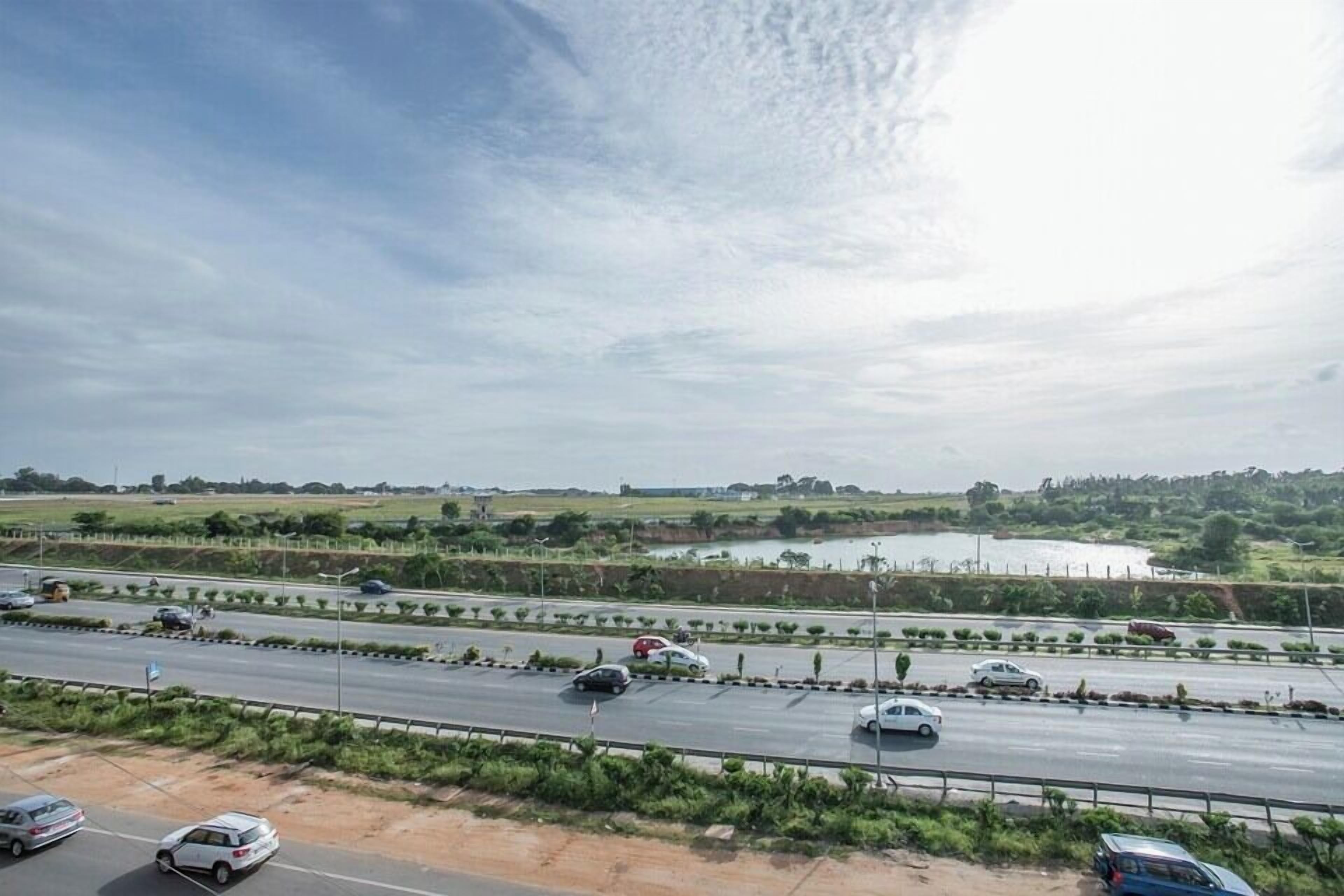 A highway with multiple lanes and vehicles.