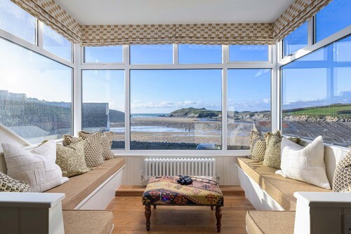 Porth Beach House is a laid-back coastal pad with front-row views of Porth beach sleeps 10
