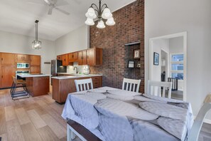 Relax in this stylish apartment with a large bed, dining area, and fully equipped kitchen.