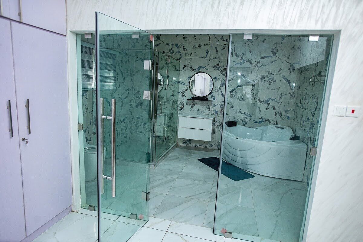 Shower, hair dryer, towels, toilet paper