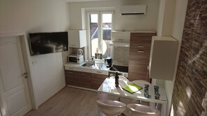 Standard Apartment | Private kitchen | Full-size fridge, stovetop, dishwasher, electric kettle - Apartments Budin (Rijeka)