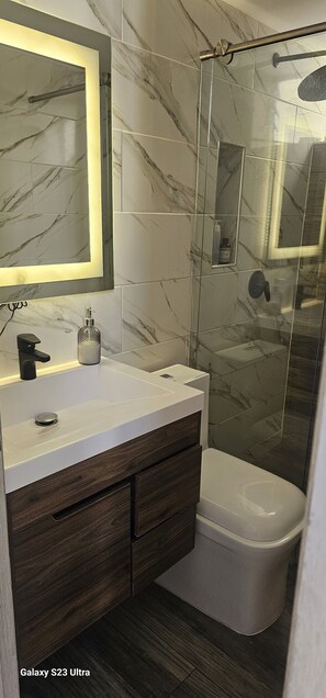 Shower, towels, soap, toilet paper