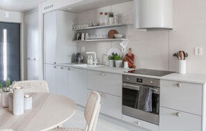 Fridge, dishwasher, coffee/tea maker, cookware/dishes/utensils