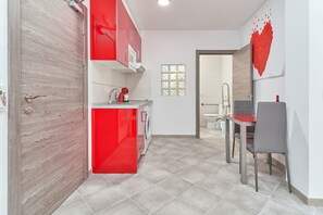 Fridge, microwave, stovetop, coffee/tea maker