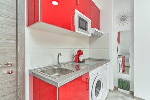 Fridge, microwave, stovetop, coffee/tea maker