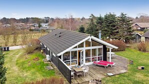 A house with a large deck, a covered patio, and a view of the surrounding neighborhood. - Cozy home in Vordingborg with WiFi (Vordingborg)