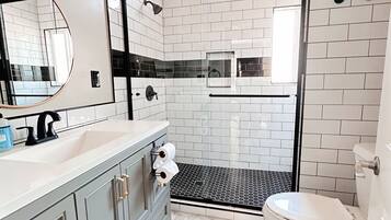Shower, hair dryer, towels, soap