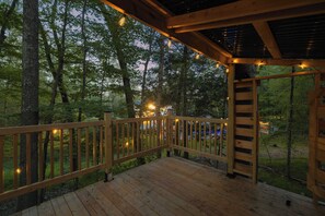 A wooden deck with a railing overlooking a forested area. - Woodstock Family Home w/ Tree House + Heated Pool (Woodstock)