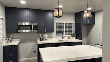 Microwave, oven, coffee/tea maker, cookware/dishes/utensils