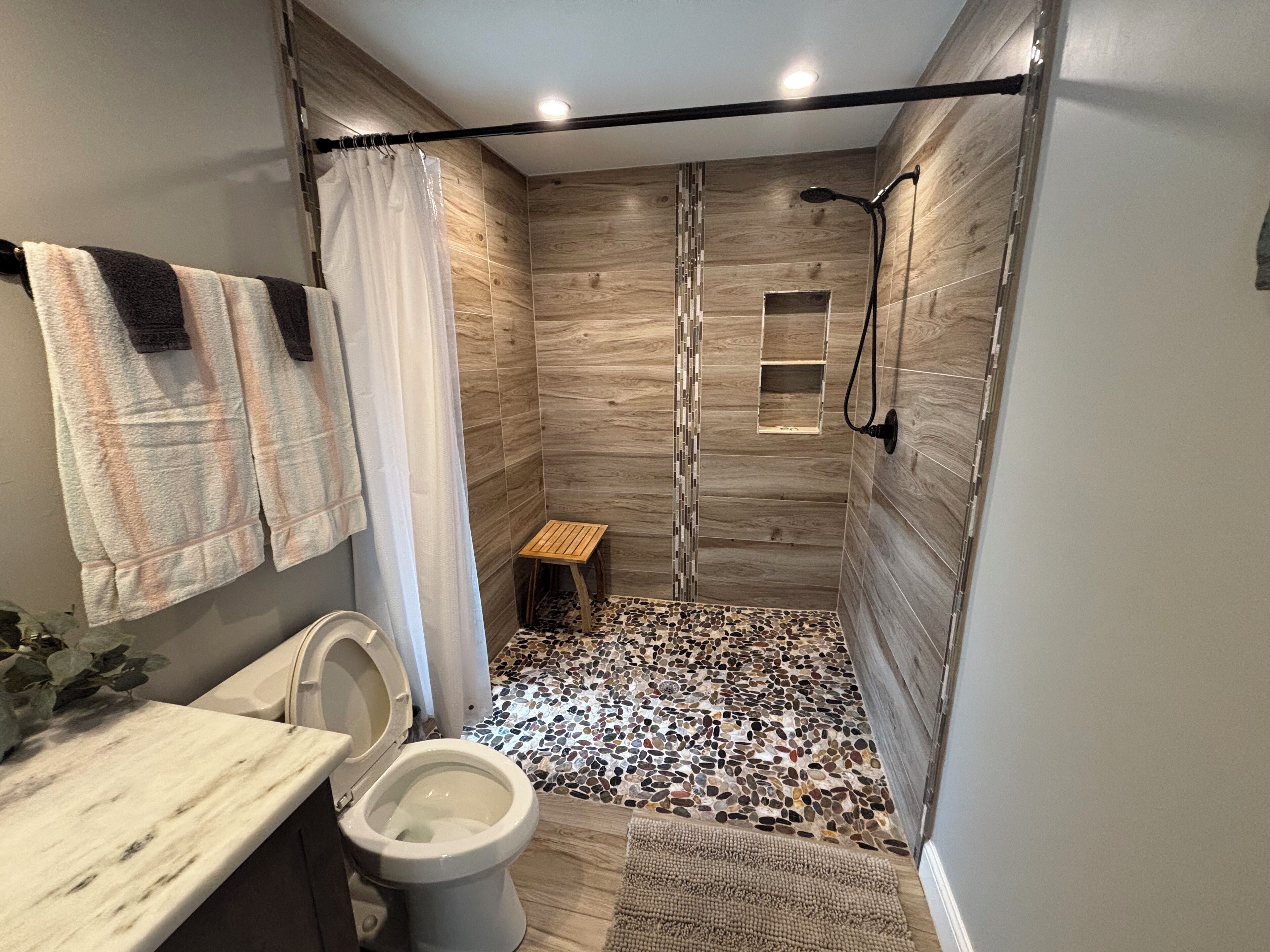 Shower, hair dryer, towels, soap