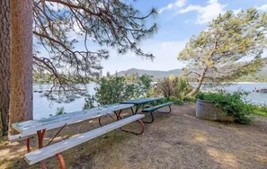 Outdoor dining - Shoreline cabin with lake views & boat slip (Bass Lake)