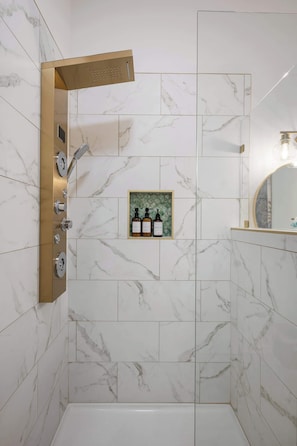 Shower, hair dryer, towels, shampoo