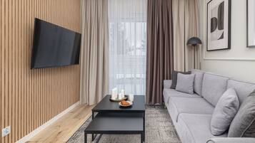 Departamento, 1 habitación, Terraza, junto a la playa | Sala de estar