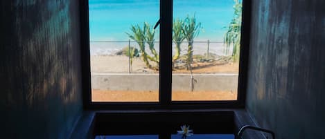 Luxury Studio Suite, 1 King Bed, Ocean View, Oceanfront | Bathroom | Combined shower/tub, rainfall showerhead, hair dryer, bathrobes