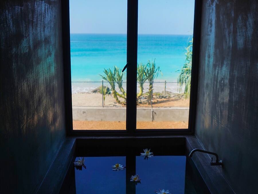 Luxury Studio Suite, 1 King Bed, Ocean View, Oceanfront | Bathroom | Combined shower/tub, rainfall showerhead, hair dryer, bathrobes