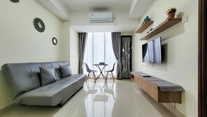 Luksusleilighet, 1 kingsize-seng med sovesofa | Oppholdsområde | En 25-tommers Flatskjerm-TV med digitale kanaler