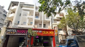 A hotel with a sign reading "HOTEL NOOC". - Tam My Hotel (Ho Chi Minh City)