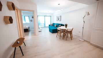 Standard Apartment, 1 Bedroom, Balcony, Partial Sea View | Living area | 100-cm LCD TV with cable channels, printers