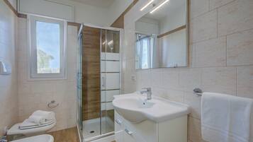 Standard Apartment, 2 Bedrooms (Le Bianche Apt1 with Garden Near The) | Bathroom | Shower, hair dryer, bidet, towels
