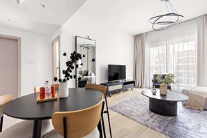 Classic Apartment | Living area | 50-inch Smart TV with digital channels - Silkhaus Waters Edge Tower - Yas Island (Abu Dhabi)