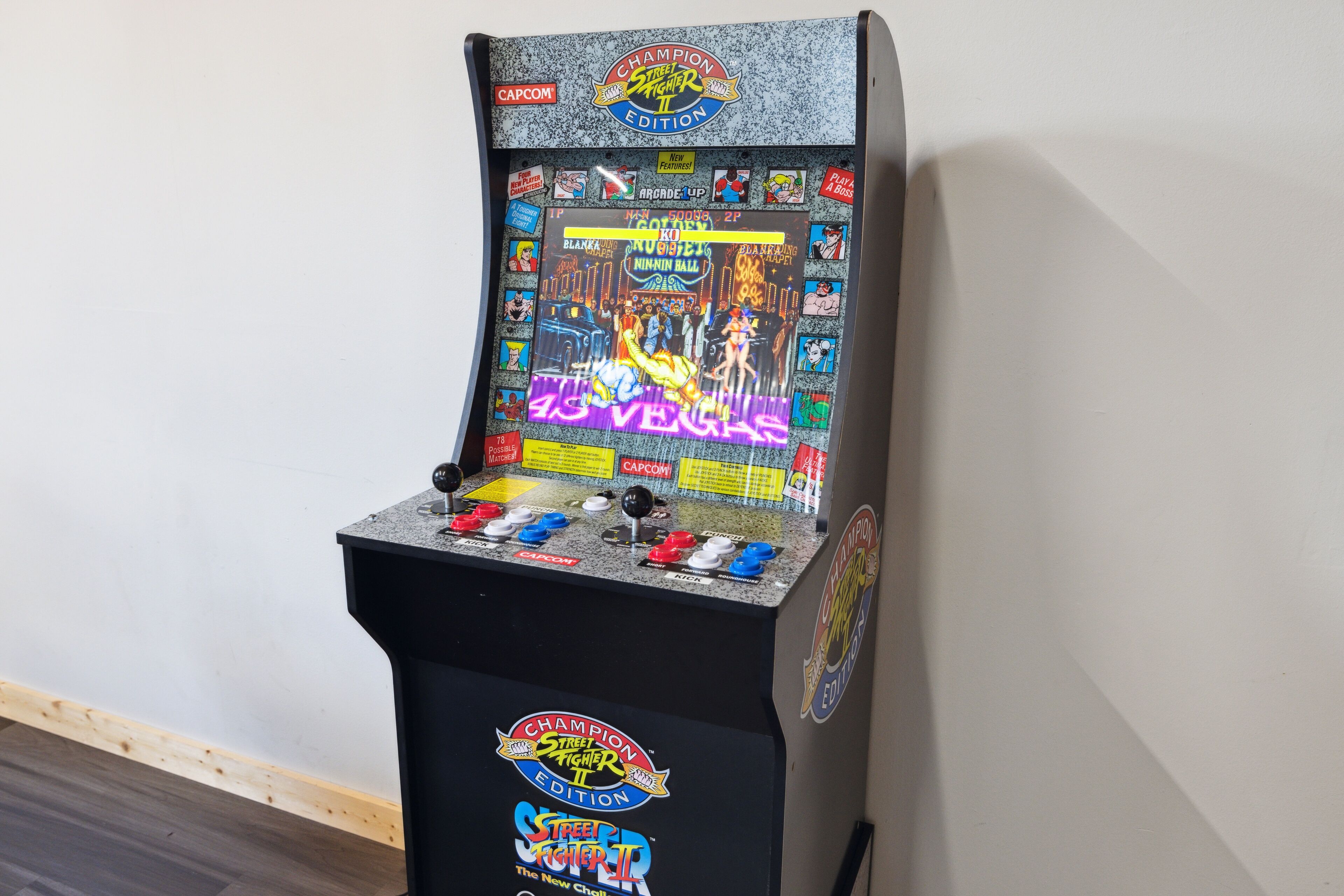 A vintage arcade machine with a colorful display and joystick controls.