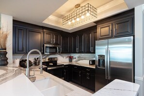Condo, 2 Bedrooms | Private kitchen | Fridge, oven, coffee/tea maker
