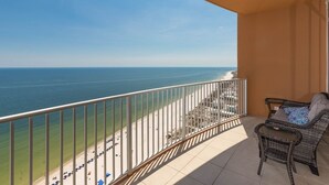 A balcony with a view of the beach and ocean. - Phoenix Gulf Towers 2602 2 Bedroom Condo (Orange Beach)