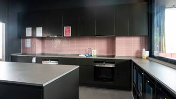 Fridge, microwave, coffee/tea maker, cookware/dishes/utensils