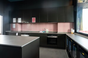 Fridge, microwave, coffee/tea maker, cookware/dishes/utensils