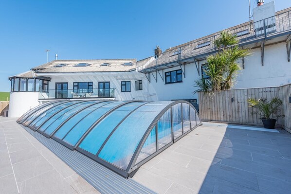 Pool enclosure slides over, stay warm and swim in the rain! 