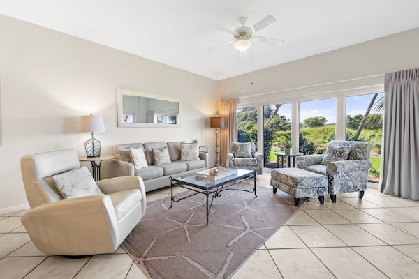 Spacious living area with plenty of seating, big screen TV and beautiful views.
