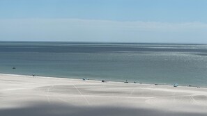 On the beach, sun-loungers
