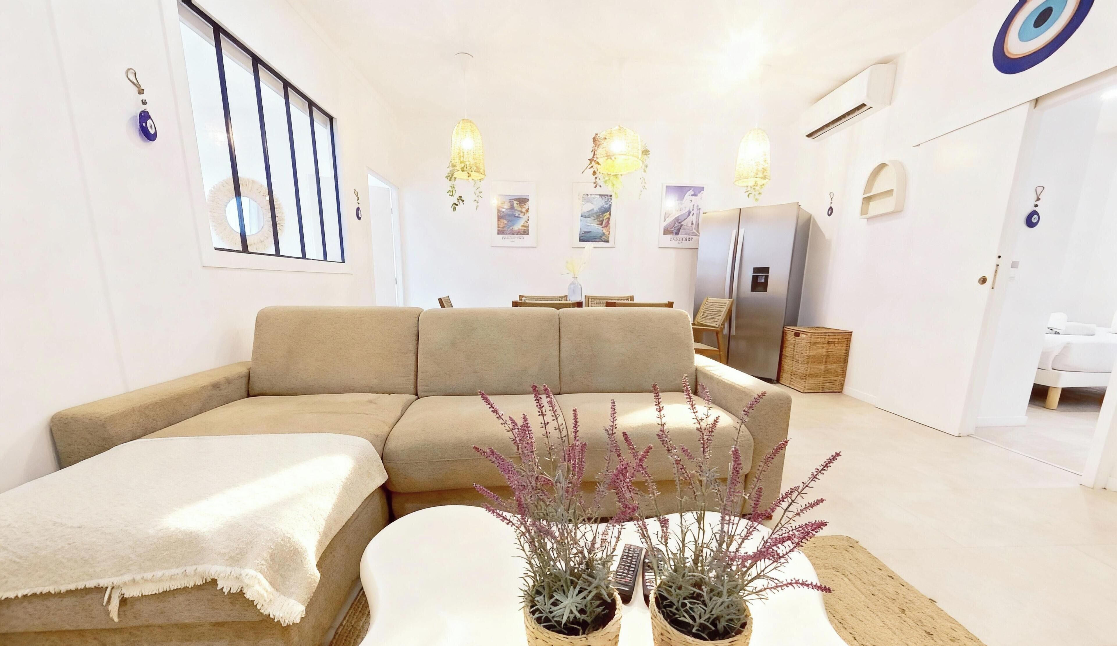MYKONOS | Living area | 107-cm flat-screen TV with cable channels, Netflix, pay films