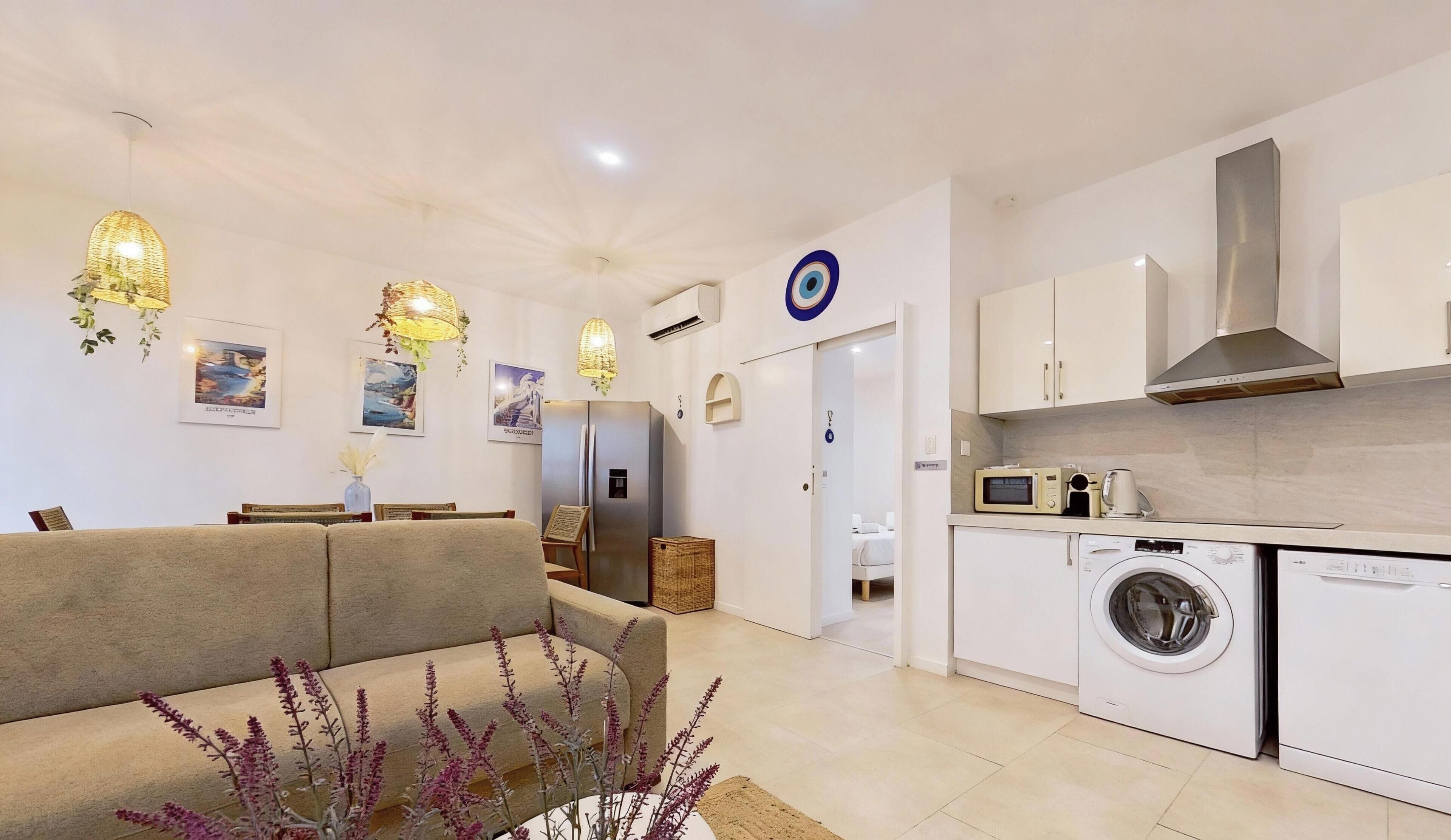 MYKONOS | Área de estar | TV de tela plana 107 cm com canais a cabo, Netflix, filmes pagos