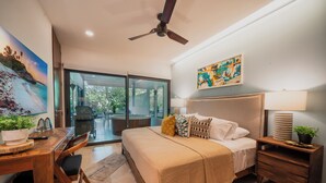 A bedroom with a bed, bedside tables, a desk, and a chair. - Maricruz - Luxury Condo with Jacuzzi (Playa del Carmen)