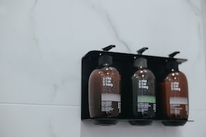 Shower, rainfall showerhead, hair dryer, towels