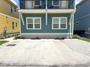 A two-story building with a balcony on the second floor, numbered 305. - The Prairie Suite. Newly Built, Upscale, Central (Gainesville)