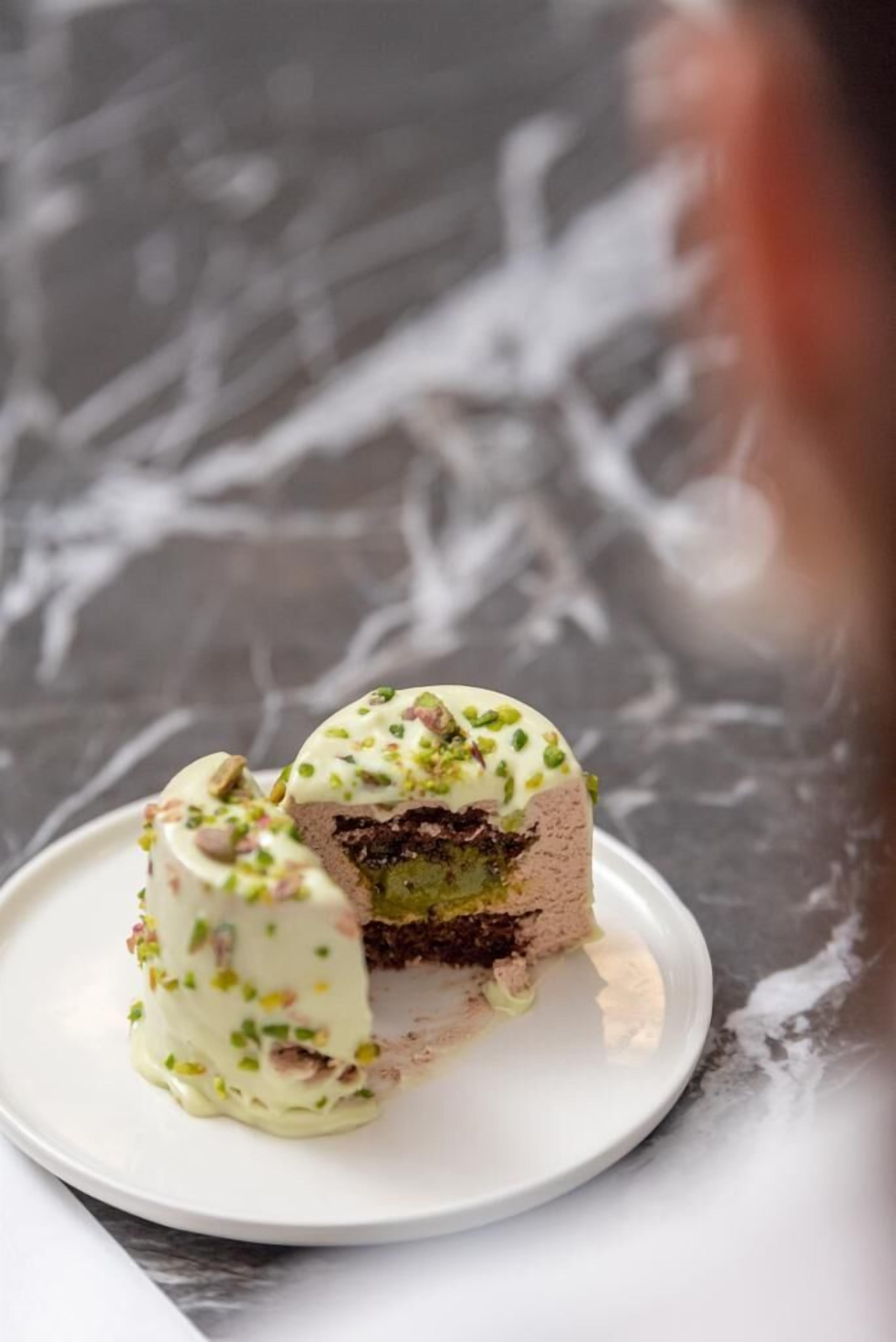 A dessert on a white plate with a marble background.