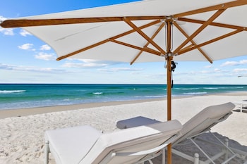 Private beach, white sand, sun loungers, beach umbrellas at Kaiya Beach Resort