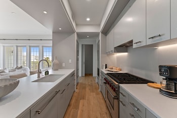 Club Room (AA-Club Residence 308) | Private kitchen | Full-size fridge, microwave, oven, stovetop at Kaiya Beach Resort