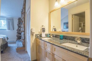 Shower, hair dryer, towels, toilet paper