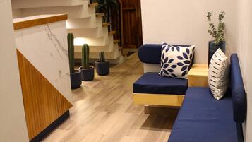 Habitación empresarial | Área de sala de estar