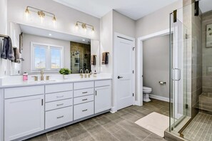 Shower, hair dryer, towels, shampoo