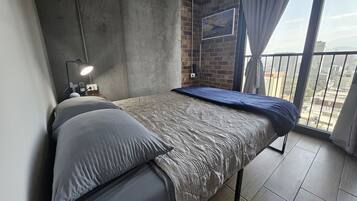 Desk, laptop workspace, free WiFi, bed sheets