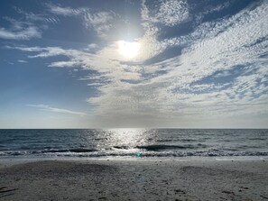 On the beach, sun-loungers, beach towels