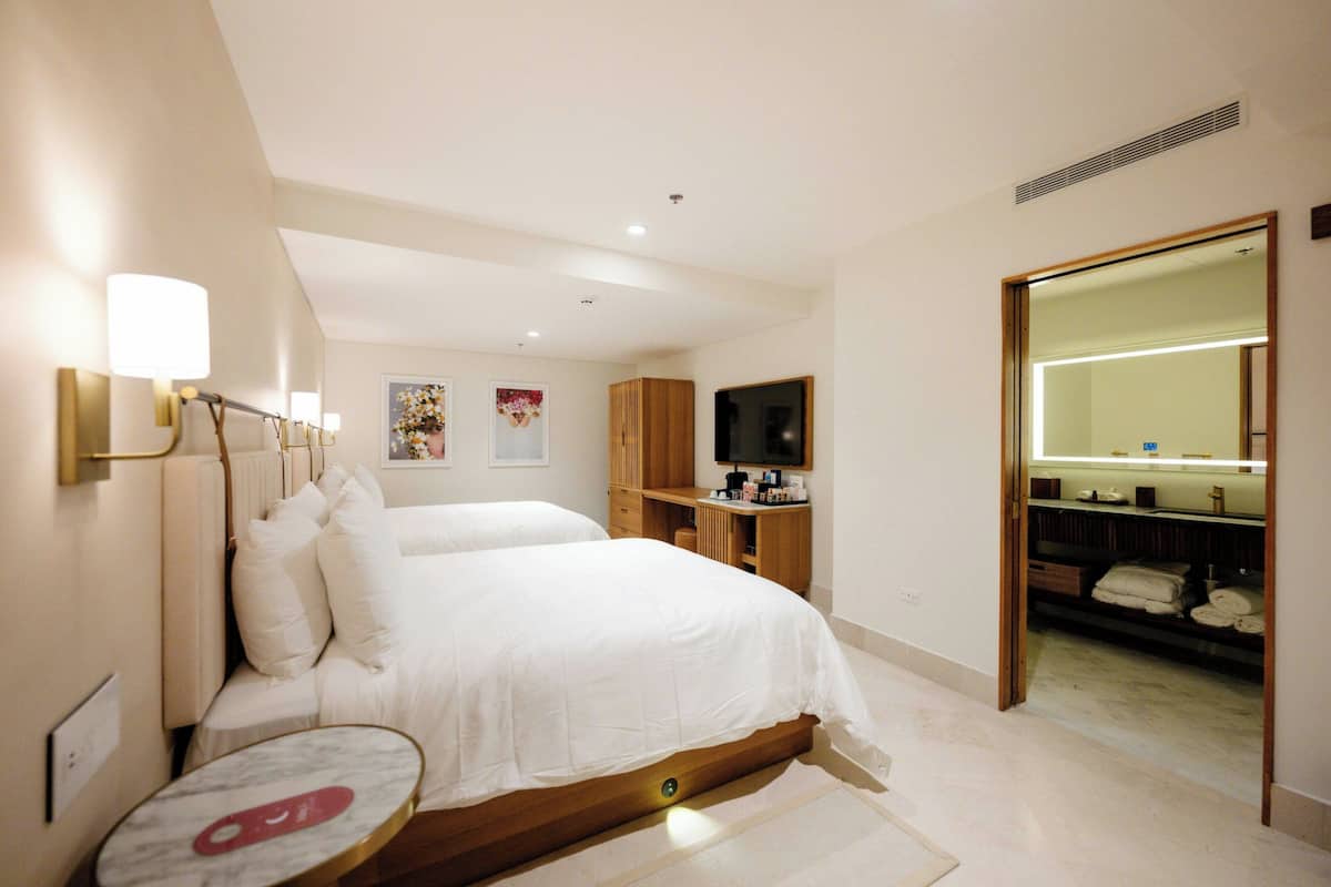 Deluxe Room, 2 Double Beds | Pillowtop beds, minibar, in-room safe, desk
